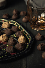 chocolate truffles over rustic wood table
