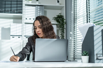 Beautiful business Latino woman employee smile while work in office. 