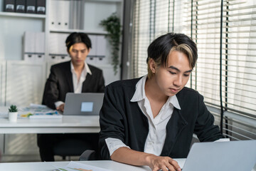 Asian handsome businessman gay people working in office with happiness