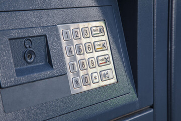 keypad with numbers on money banking transit machine to enter pin code before getting money out of...