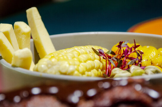 corn with cheese, beans and melloco (choclo con queso, habas y melloco), typical and traditional ecuadorian food. 