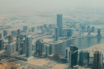 Naklejka na ściany i meble View to skyscrapers and urban architecture of Dubai downtown and Financial Center area from a high building