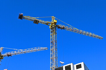 Crane and highrise construction site