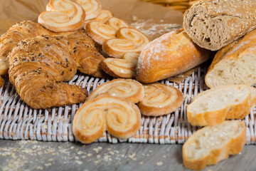 Image of various kinds of bread and bakery products on table