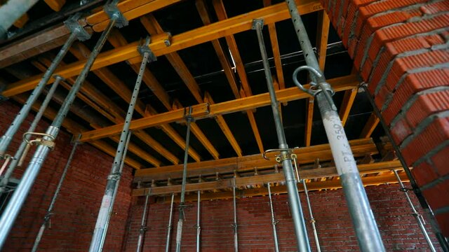 Inside a building under construction. Construction industry. The process of creating a floor. Formwork flooring. formwork rack.