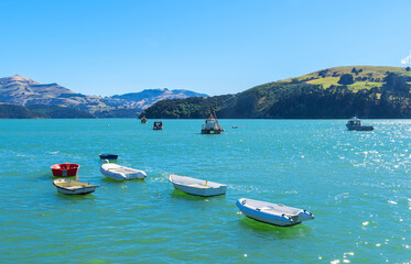 Dinghy and Boats at Akaroa Beach on the Banks Peninsula, southeast of Christchurch, South Island, New Zealand