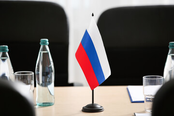Russian flag on table in conference room