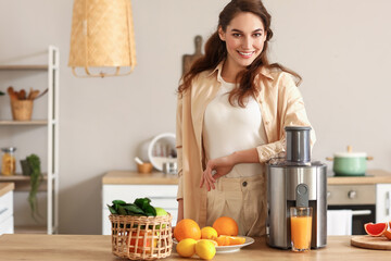 Young woman preparing healthy fruit juice in kitchen