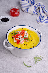 Yellow puree with crab meat and red caviar.