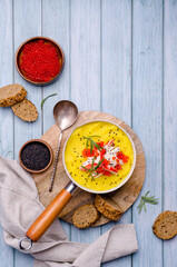 Yellow puree with crab meat and red caviar.