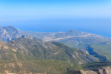 View of the Taurus mountains and the Mediterranean sea from a top of Tahtali mountain near Kemer, Antalya Province in Turkey