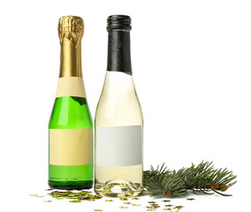 Bottles of champagne with confetti and fir branch on white background