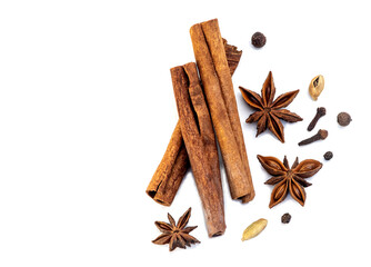 spice isolate. a set of spices for mulled wine. anise, cinnamon and cloves on a white table. spices for making a winter drink on a white background - obrazy, fototapety, plakaty