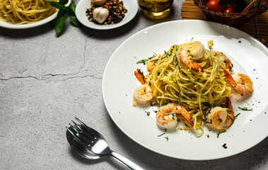 Tasty homemade spaghetti with shrimp olive oil and basil. This is healthy Italian food presenting from above.