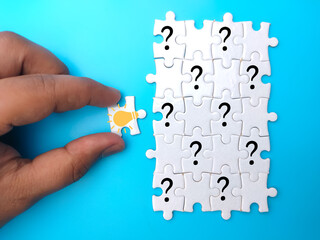 Puzzles with question mark icons and ideas. the concept of questions and answers