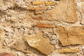 cave wall lined with different colored stones
