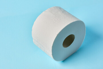 White toilet paper on blue color background. Toilet paper article. Textures on cotton paper.