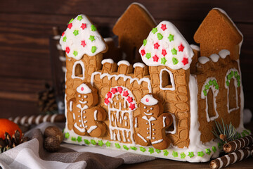 Gingerbread house on wooden background
