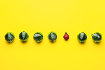 Beautiful Christmas balls on yellow background