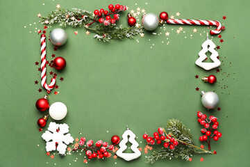 Frame made of beautiful Christmas decorations on green background