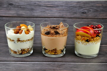 Granola with greek yogurt, cranberry, nuts and apple . Healthy energy breakfast.