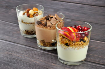 Granola with greek yogurt, cranberry, nuts and apple . Healthy energy breakfast.