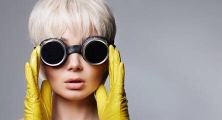 beautiful blonde hair woman in gloves and sunglasses