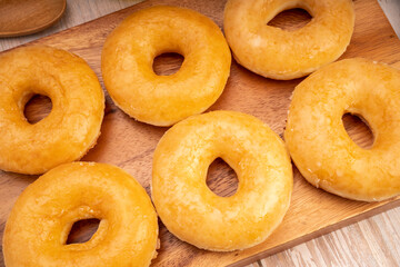 Original flavor donuts  chocolate, marmalade on wooden background. 