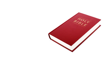 Bible with red cover color isolated on white background.