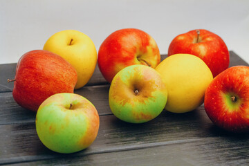 Beautiful multi-colored apples on the table
