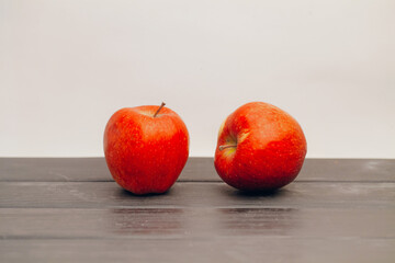 Fruit apples in a row on the table