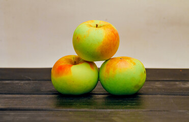 Fruit apples in a row on the table