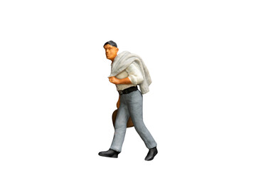Naklejka premium Miniature people holding a luggage on white background with clipping path