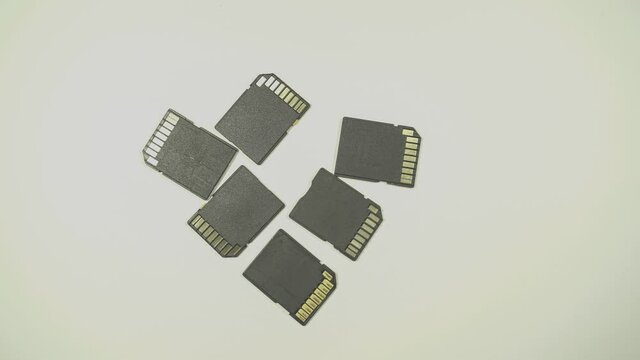 Clips video 4k and full HD of memory SD card isolated on clean background this sd card for various computer, digital camera and smart mobile phone dev