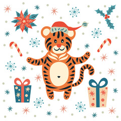Naklejka premium A tiger in a Santa hat is a symbol of the New Year. Christmas decorations.