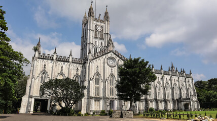 Rear view of St. Paul's Cathedral Church. The cornerstone was laid in 1839 and the building was completed in 1847, Kolkata, West Bengal, India. - obrazy, fototapety, plakaty