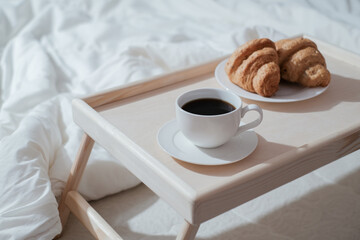 Breakfast on wooden table for bed. Coffee, cake and apple for healthy morning eating. 