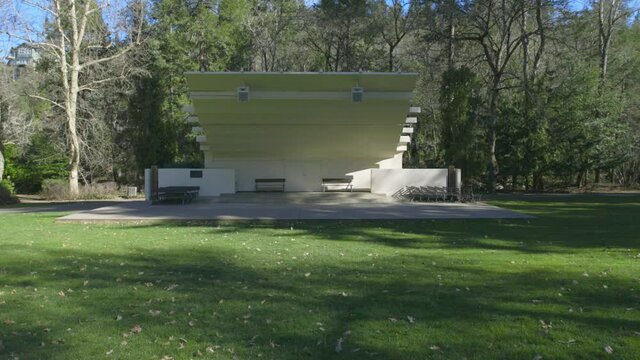 Forward moving close-up shot of the amphitheater in the beautiful green scenario around in Ashland.