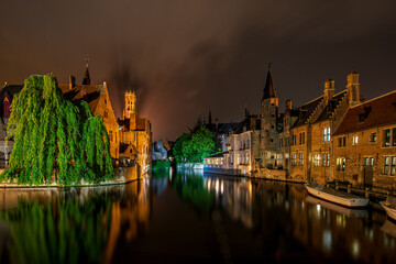 Fototapeta na wymiar A shot of some lovely evening reflections along the canal in Bruges, Belgium