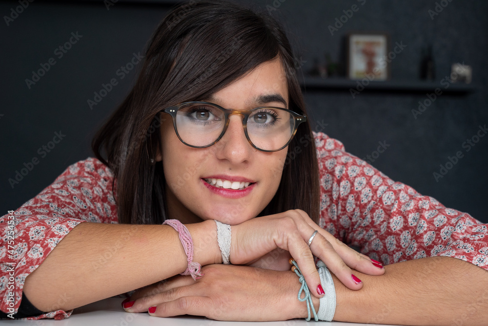 Wall mural portrait of young brunette woman smiling