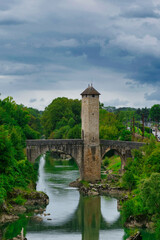 Fototapeta na wymiar medieval bridge over river Gave de Pau in Orthez - France