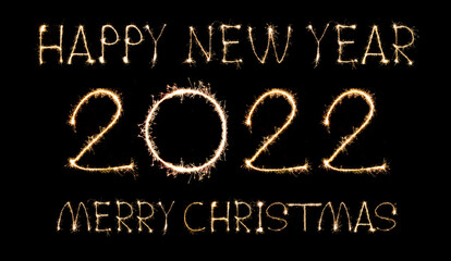Happy New Year 2022 text hand written sparkles fireworks with Colorful fireworks of various colors at night