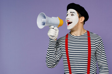 Charismatic young mime man with white face mask wears striped shirt beret hold scream in megaphone...