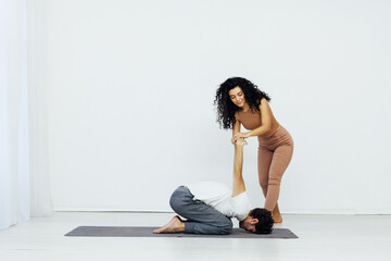 Fototapeta premium man and woman engaged in yoga asana gymnastics