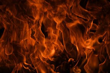 Texture of fire on a black background. Abstract fire flame background, large burning fire.