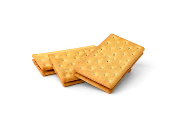 Pile of cracker sandwiches with chocolate filling isolated on white background.