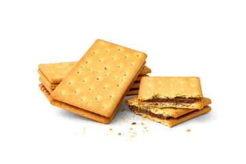 Pile of cracker sandwiches with chocolate filling isolated on white background.