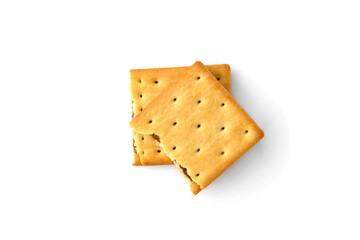 Cracker sandwich with chocolate filling isolated on white background.