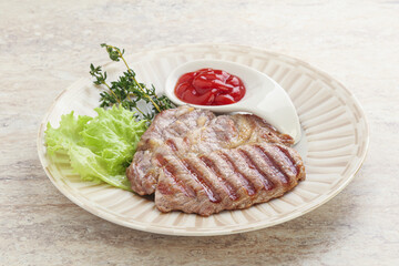 Grilled pork neck steak with ketchup