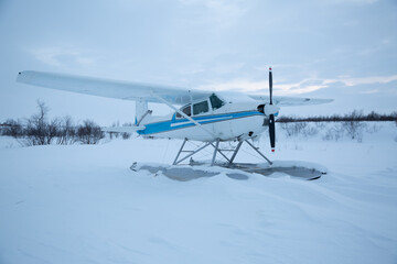 Seaplane frozen in the snow